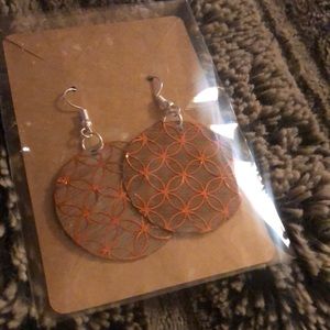 Homemade wooden earring in copper
